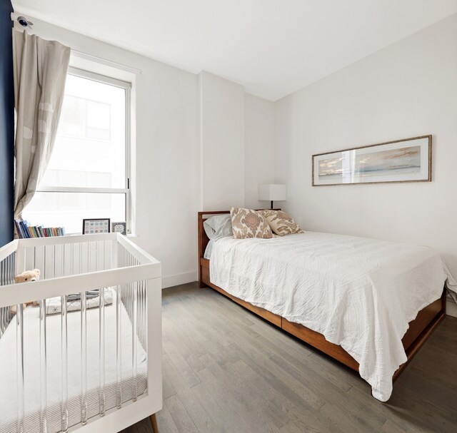 bedroom with hardwood / wood-style flooring