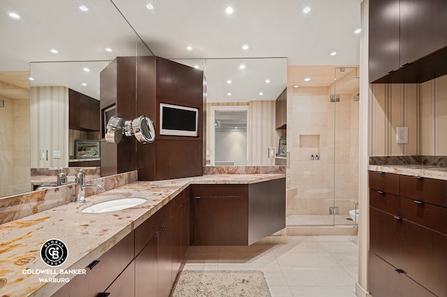 full bathroom with vanity, a shower stall, recessed lighting, and tile patterned flooring