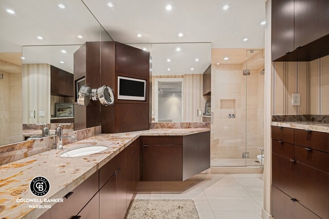 190 E 72nd St Unit 34Cd, New York City, NY 10021 - bathroom featuring a stall shower, tile patterned floors, two vanities, and recessed lighting