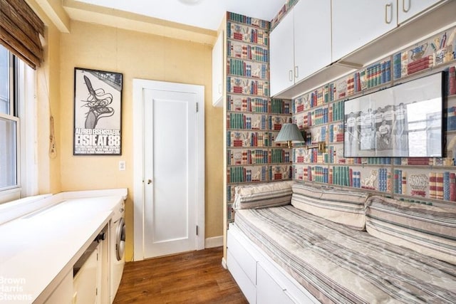 bathroom featuring wood-type flooring and washer and dryer