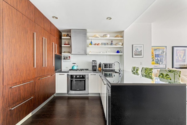 kitchen with modern cabinets, brown cabinets, oven, open shelves, and a sink