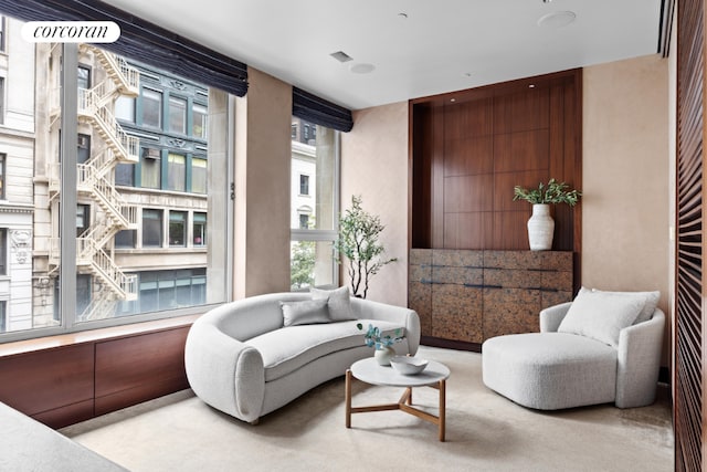 living area featuring light colored carpet