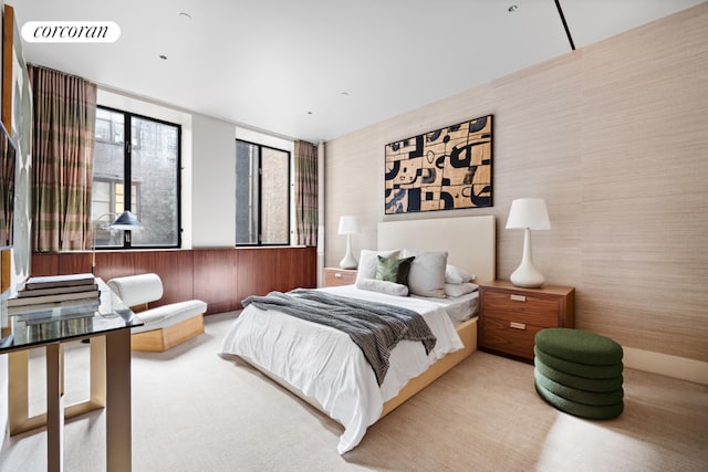 carpeted bedroom with expansive windows