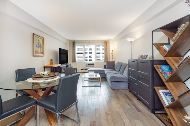 dining space with light wood-style flooring