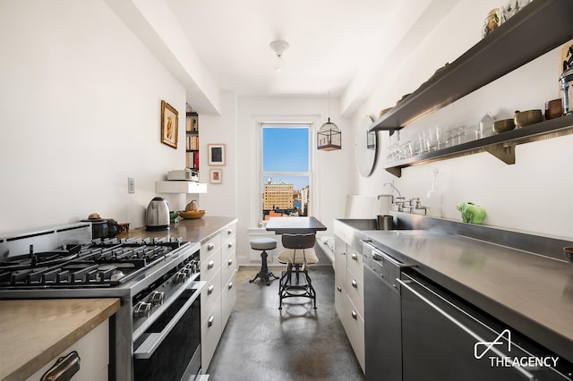 kitchen with white cabinets, stainless steel appliances, stainless steel counters, finished concrete floors, and open shelves
