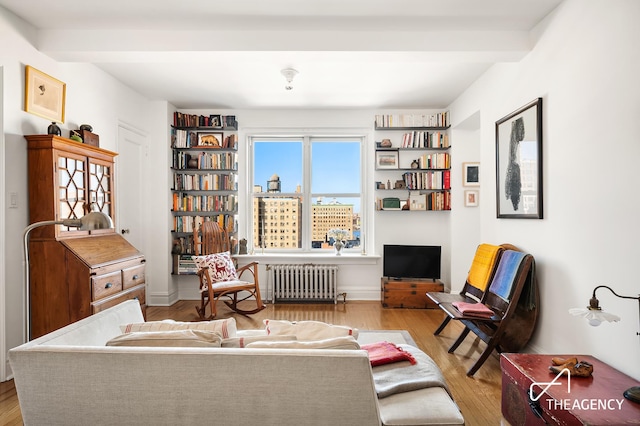 200 W 108th St Unit 15D, New York City, NY 10025 - living area featuring radiator and wood finished floors