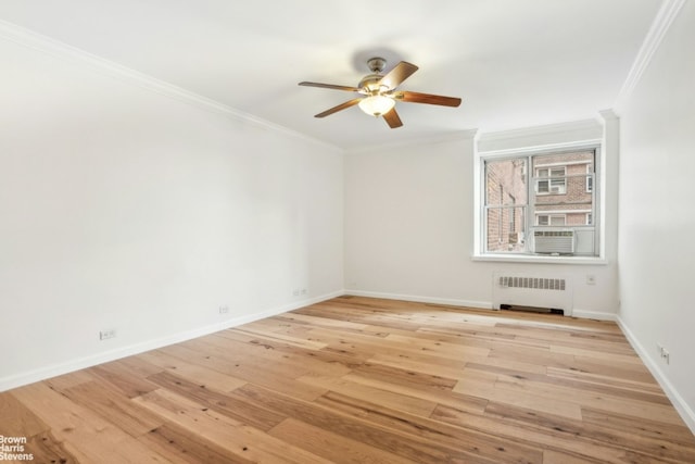 empty room featuring light hardwood / wood-style flooring, ceiling fan, radiator heating unit, and ornamental molding