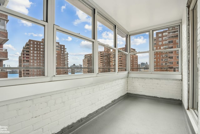 unfurnished sunroom with a view of city