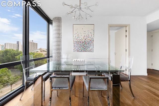 dining area with expansive windows and a chandelier