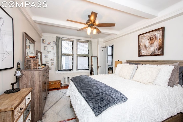 bedroom with ceiling fan, beamed ceiling, and radiator heating unit