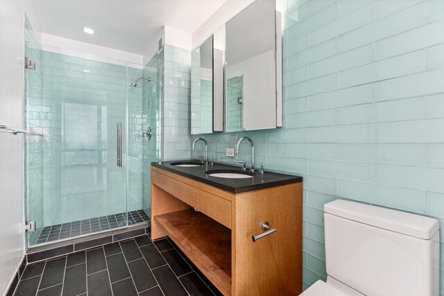 spare room featuring expansive windows and light hardwood / wood-style floors