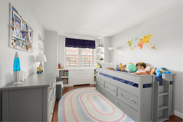 bedroom featuring wood finished floors