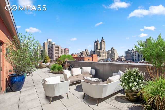 view of patio with a view of city and an outdoor hangout area