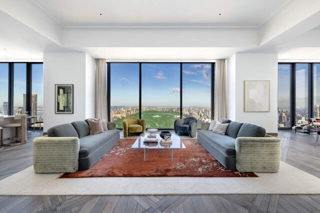 living room featuring floor to ceiling windows