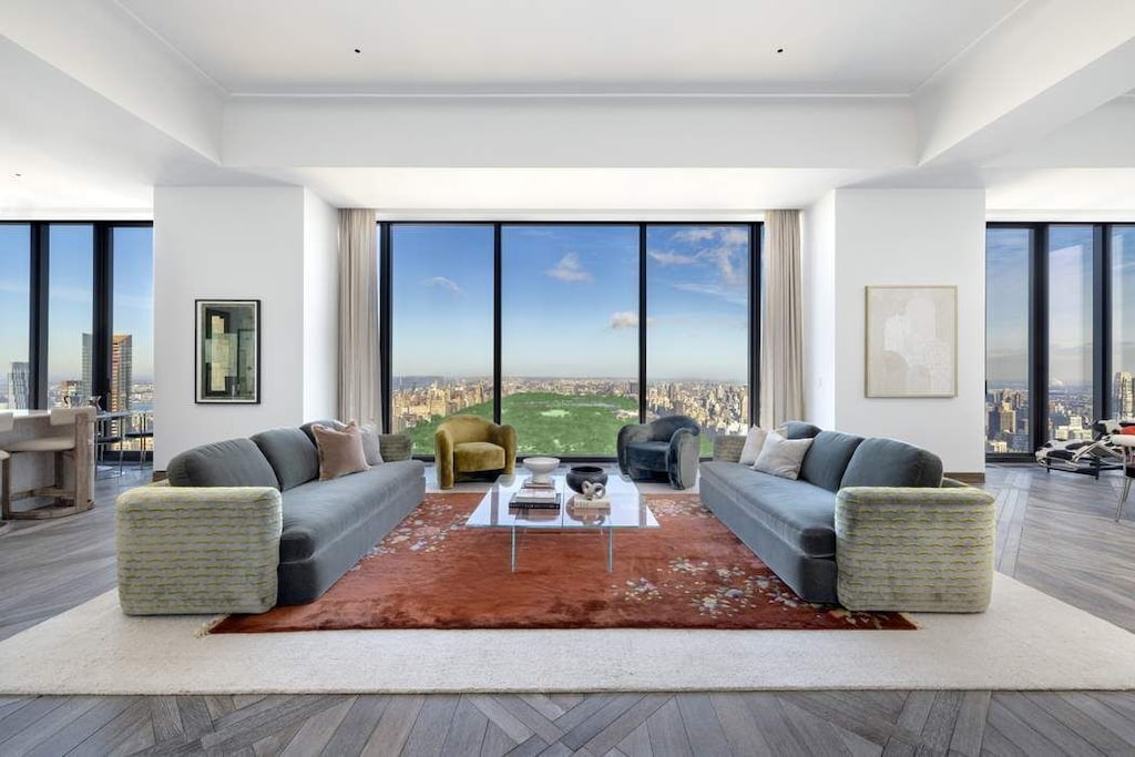 living room featuring floor to ceiling windows and hardwood / wood-style floors