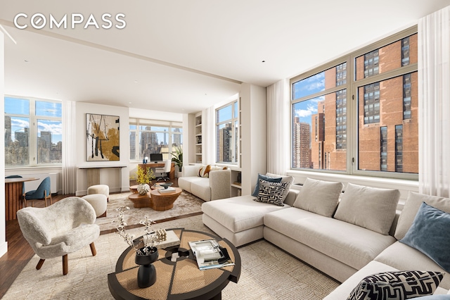 1760 2nd Ave Unit 20/21C, New York City, NY 10128 - living room with wood finished floors and built in features