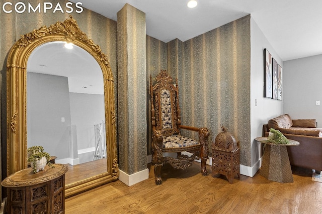 hallway with hardwood / wood-style flooring