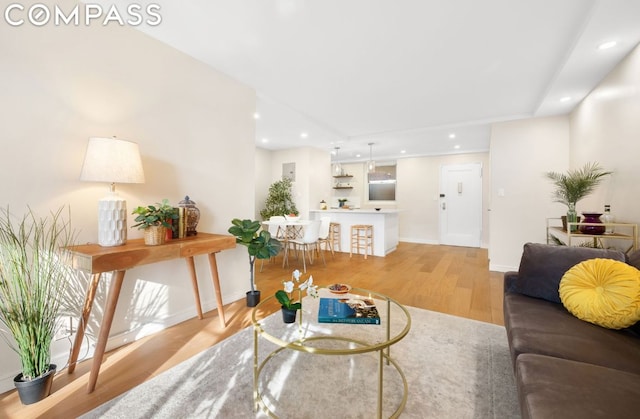 living room with light hardwood / wood-style floors