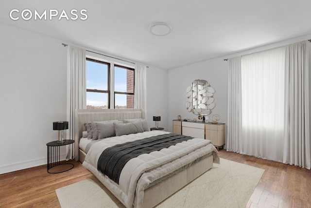 bedroom with light wood-type flooring