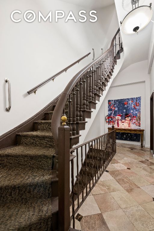 staircase with stone finish floor