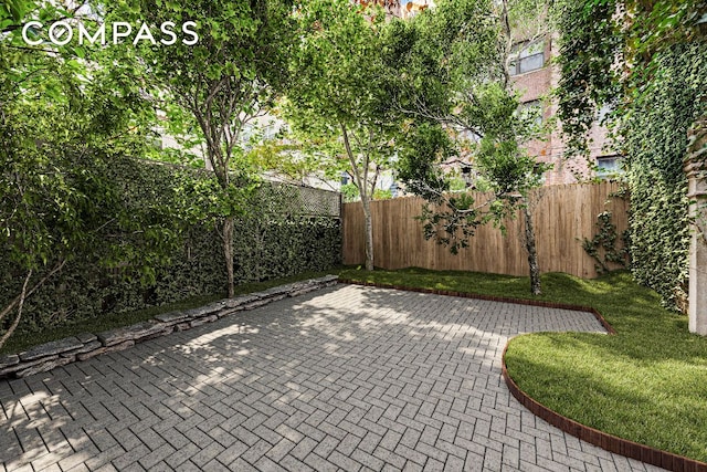 view of patio featuring a fenced backyard