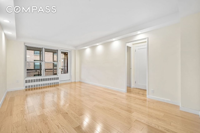 spare room with light wood-type flooring