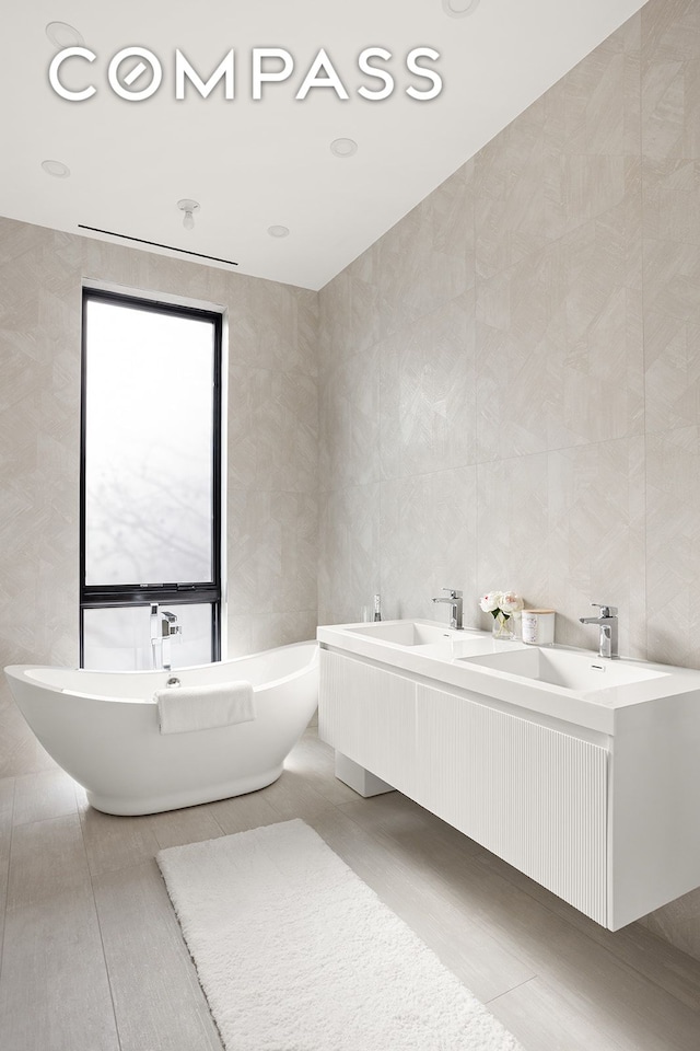 145 Conselyea St, New York City, NY 11211 - full bathroom featuring a freestanding bath and double sink
