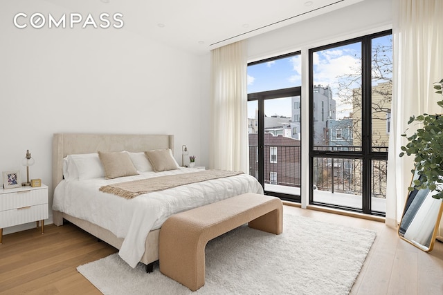 145 Conselyea St, New York City, NY 11211 - bedroom featuring access to outside and wood finished floors