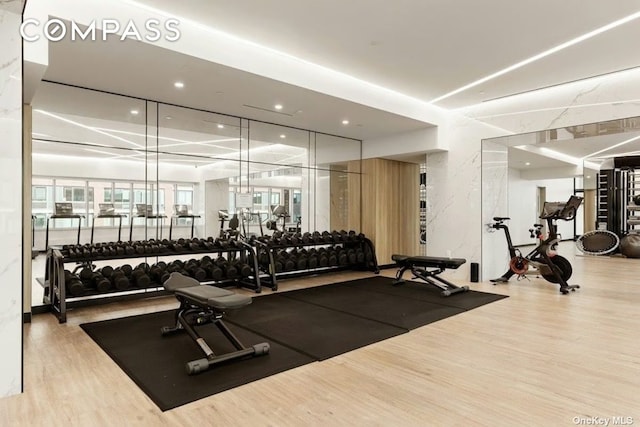 gym with wood finished floors