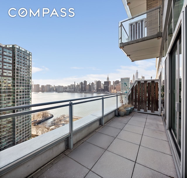 balcony with a city view and a water view