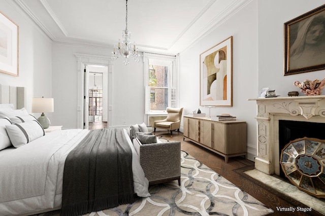 bedroom with crown molding, dark parquet flooring, and a notable chandelier