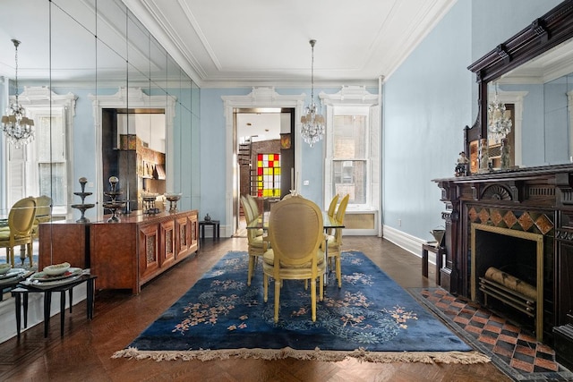 dining space with ornamental molding, dark parquet flooring, and a chandelier