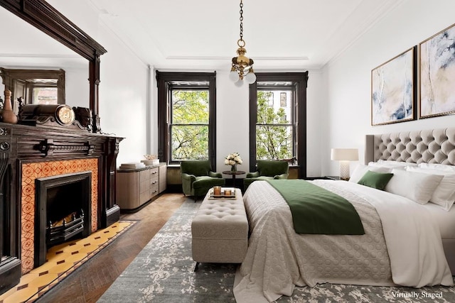 bedroom featuring crown molding and light parquet floors