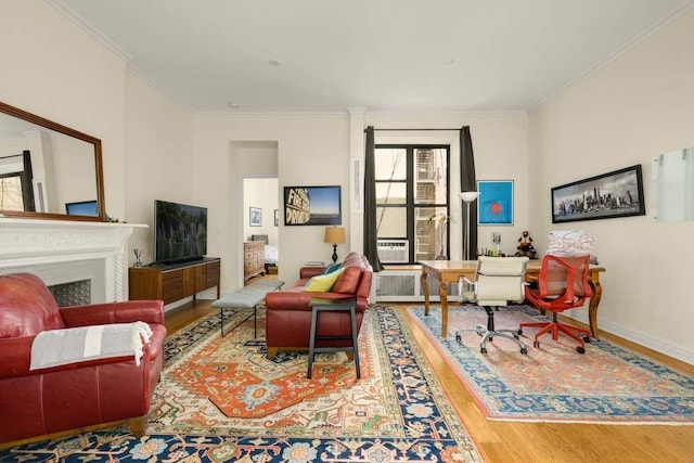 living room featuring hardwood / wood-style flooring and ornamental molding