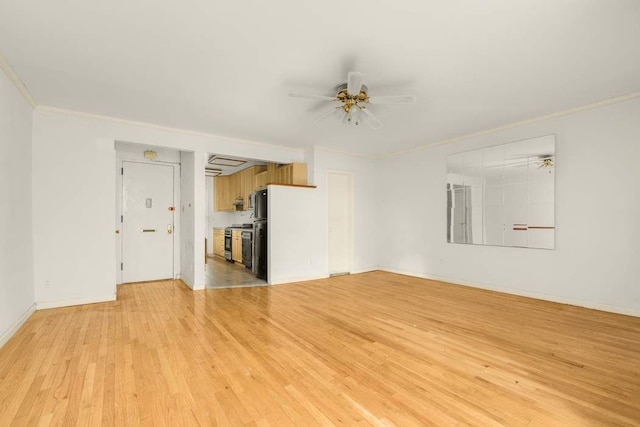 117 W 75th St Unit Twnh, New York City, NY 10023 - unfurnished living room with crown molding, light wood-style flooring, a ceiling fan, and baseboards
