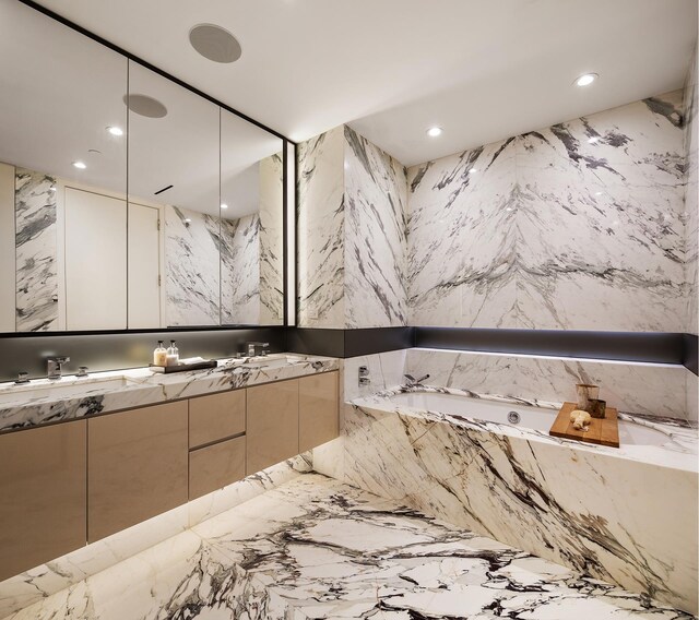 bathroom featuring vanity and a bathing tub