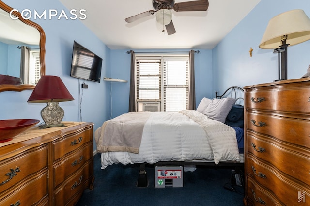 bedroom with cooling unit and ceiling fan