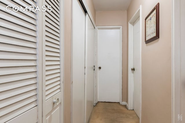 hallway with concrete floors