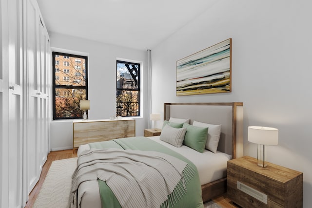 bedroom with light hardwood / wood-style floors