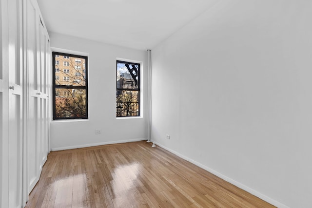 unfurnished room with light hardwood / wood-style floors