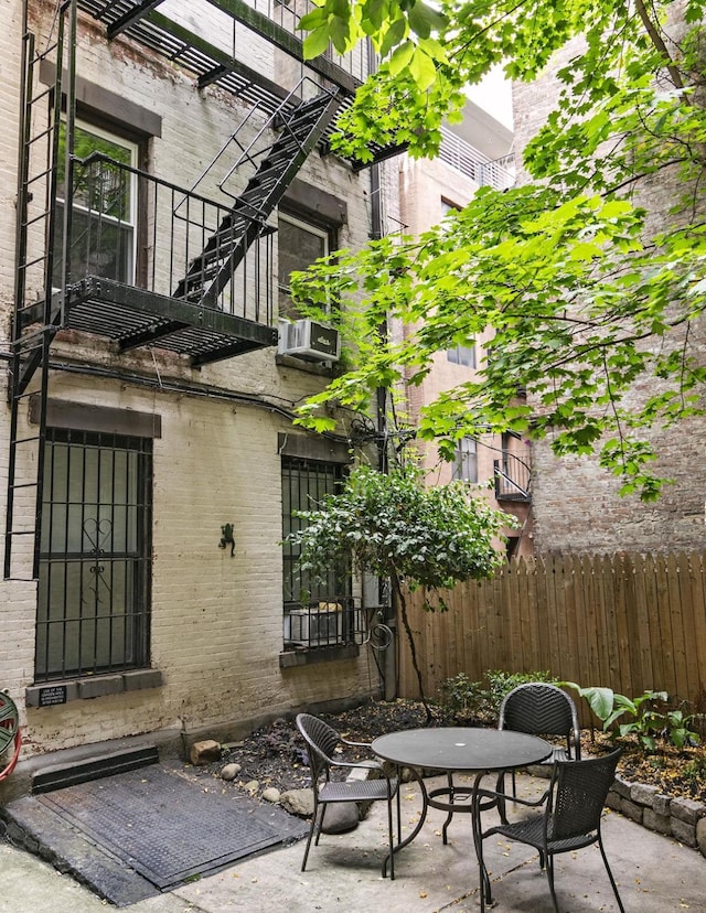 view of patio featuring fence