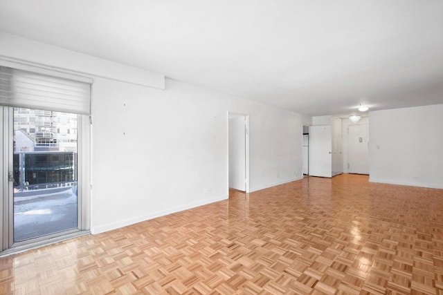 unfurnished room featuring light parquet floors