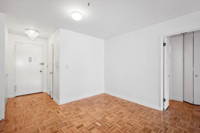 spare room with light parquet flooring