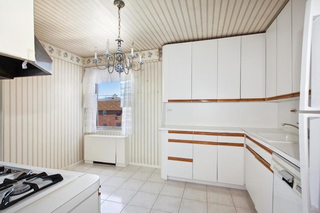 kitchen featuring pendant lighting, sink, white cabinetry, and white dishwasher