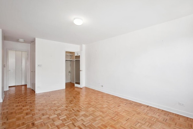 empty room with light parquet floors