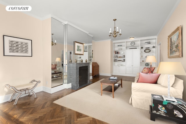 living room featuring crown molding, a notable chandelier, dark parquet flooring, and built in features