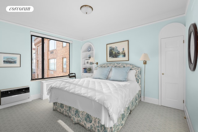 bedroom featuring heating unit, baseboards, visible vents, and light colored carpet