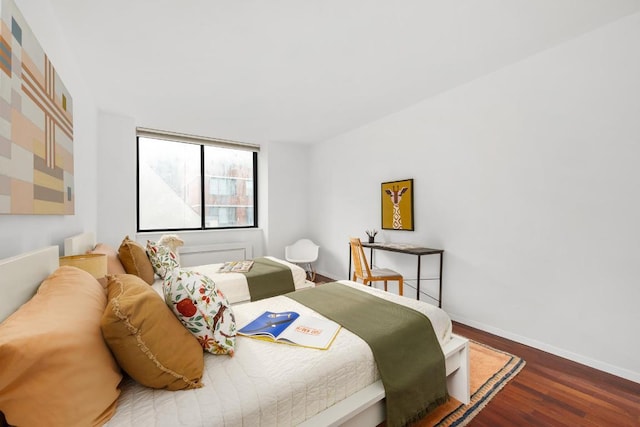 bedroom with wood-type flooring