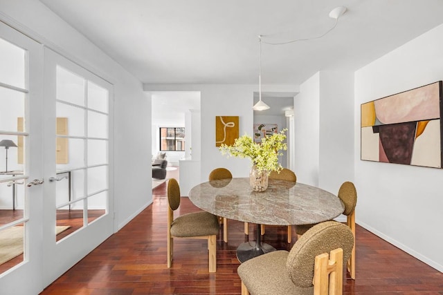 dining area featuring dark hardwood / wood-style floors