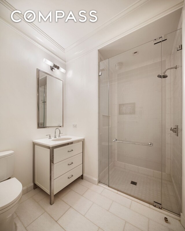 20 E End Ave Unit 4C, New York City, NY 10028 - bathroom featuring vanity, a shower stall, and crown molding